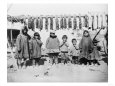 Eskimo Children in front of Dried Salmon Photograph - Alaska
